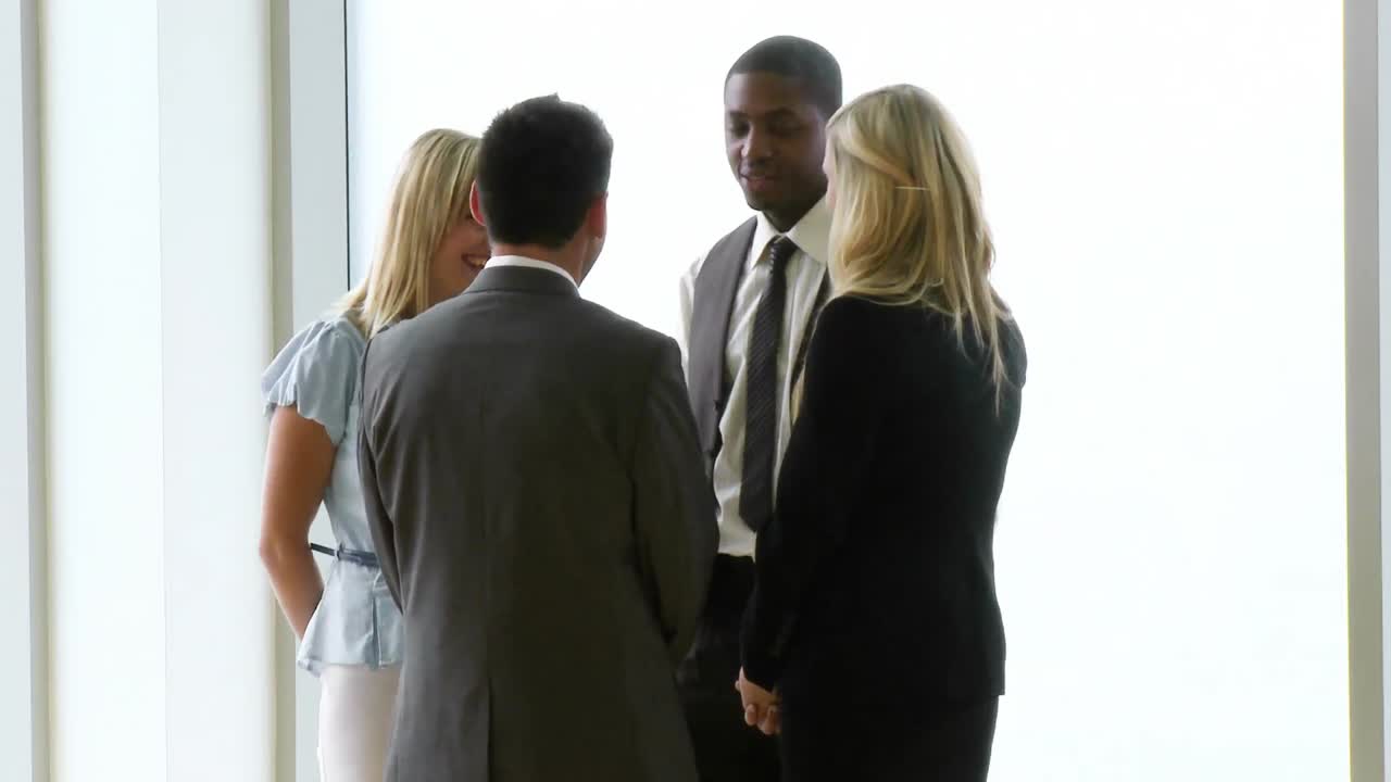 Business people speaking in workplace footage