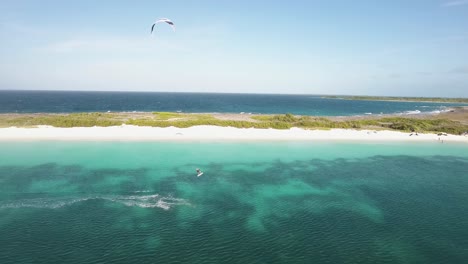 KITER-CROSS-LEFT-TO-RIGHT-amazing-beach-with-turquoise-sea-water,-CRASQUI-ISLAND-Los-Roques