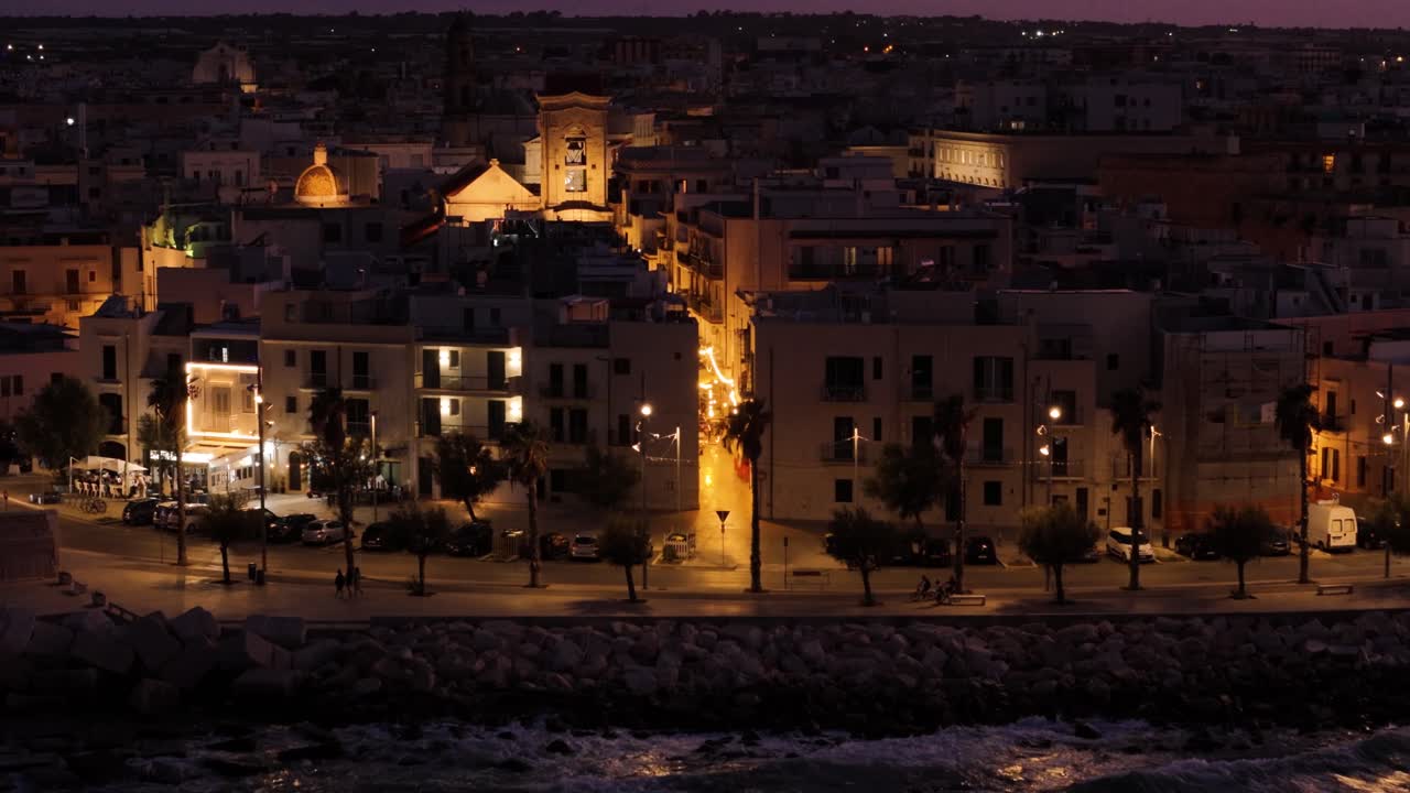 Night colors of Italian coast township, aerial view