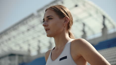 slow motion: girl athlete waits for start of race in 400 meters. girl athlete waits for start of race in 100 meters during. running at the stadium from the pads on the treadmill