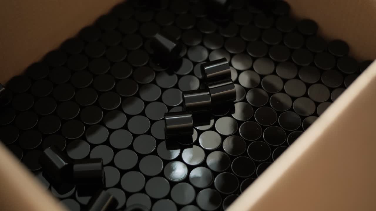 Shiny Black Cylinders and Discs in a Box