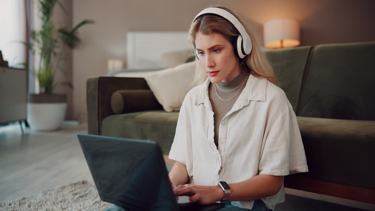 Young Woman Working on Laptop at Home