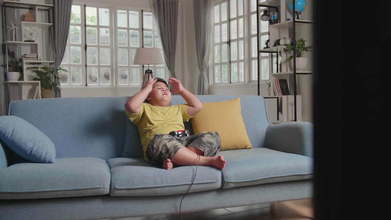 Young Boy Gamer Using Joystick Playing A Game Feeling Upset, Losing Video Game