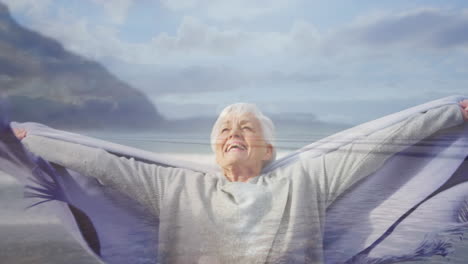 mujer vieja estirando libremente sus brazos en la playa 4k