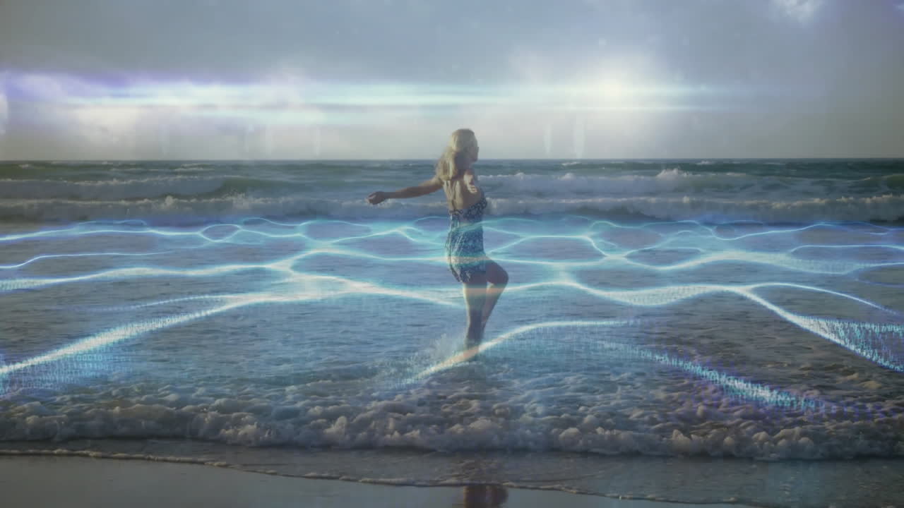 Woman standing in ocean waves with glowing blue energy animation overlay
