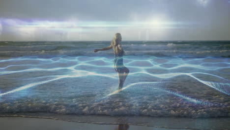 woman standing in ocean waves with glowing blue energy animation overlay