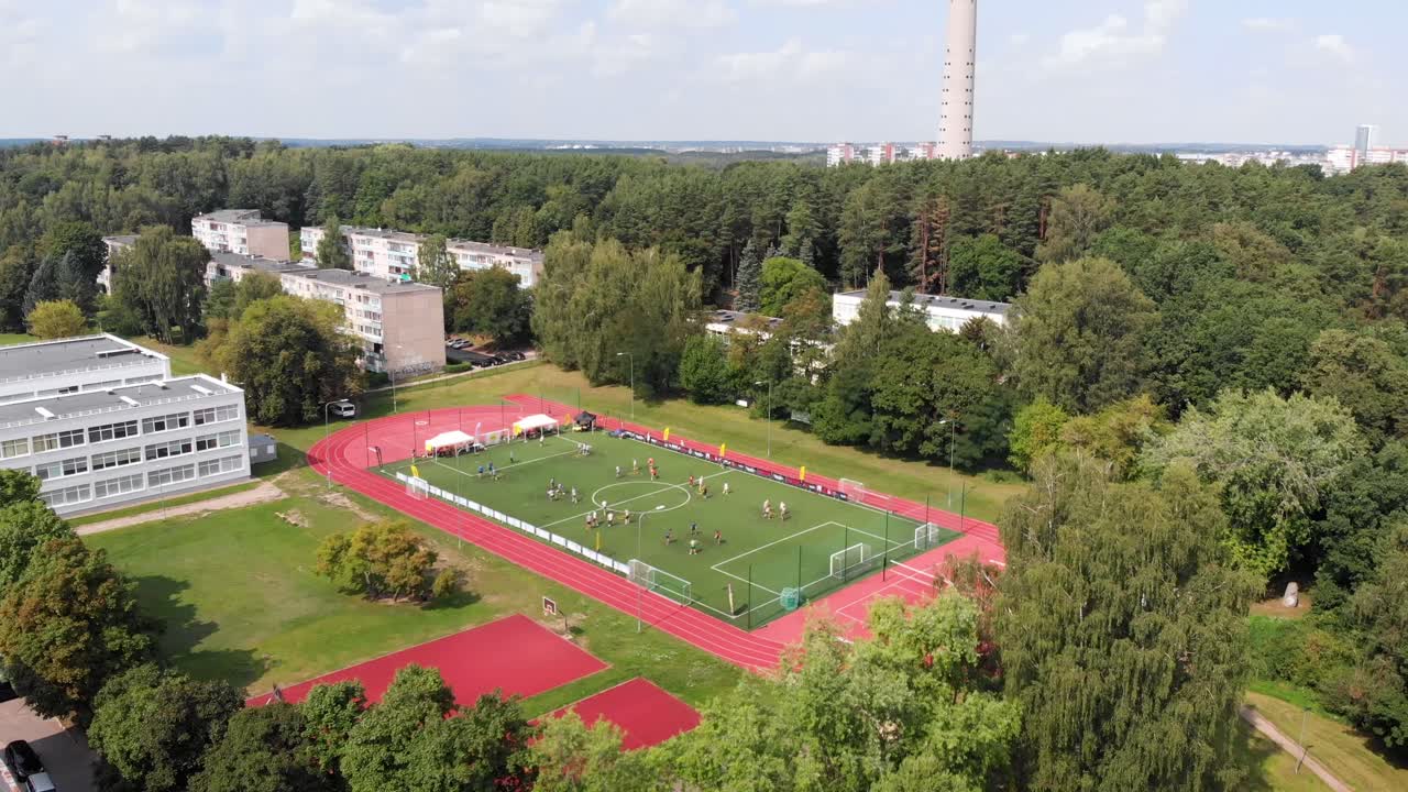 Drone shot of people playing Spikeball in a stadium