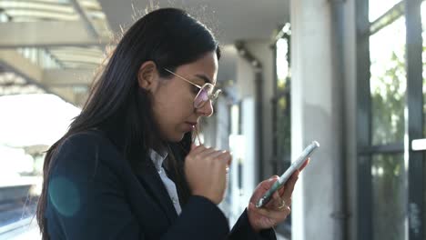 Young-businesswoman-using-smartphone