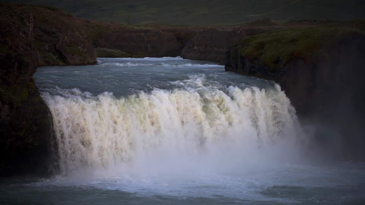 Godafoss waterfall under midnight sun, slow motion, Icelandic beauty