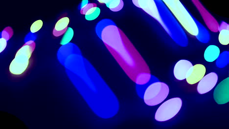 cool-colored stretching bokeh balls