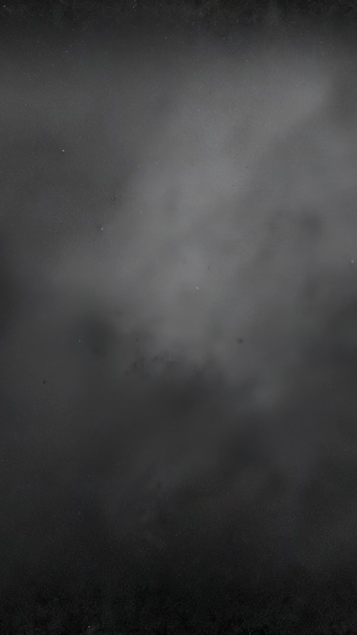 Vertical video: Light wind driving low cloud layer drifting over far treeline, showing bright speck