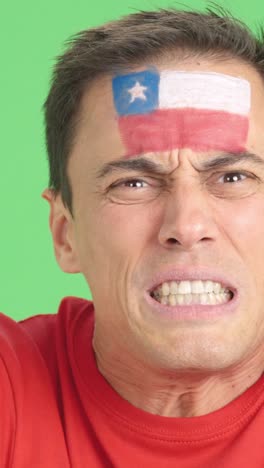 man with chilean national flag upset with a referee