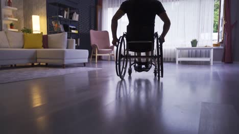 disabled young man at home in slow motion.