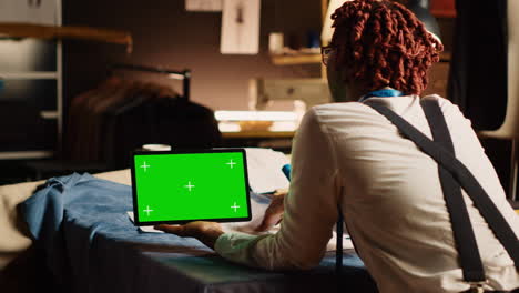 Young-tailor-checking-greenscreen