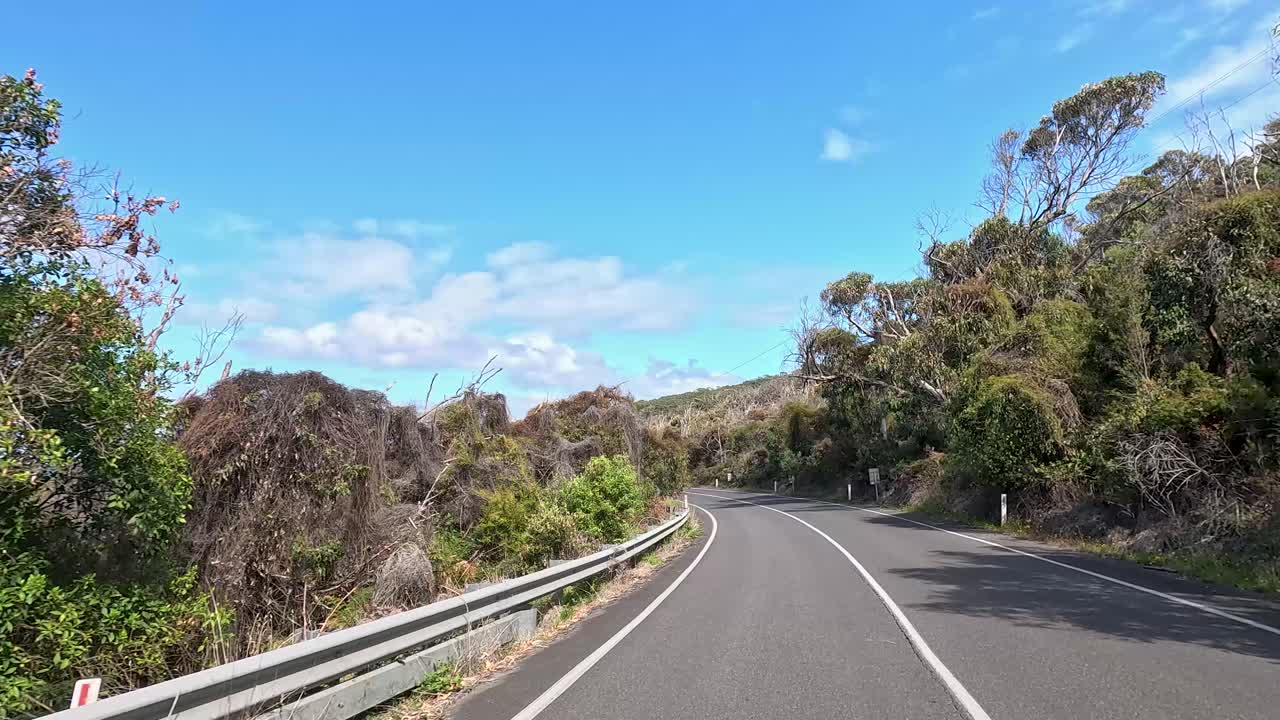 A 45-second video captures a drive along the winding Great Ocean Road, showcasing lush greenery and clear blue skies