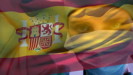 animation of waving spanish flag against caucasian female surgeon wearing surgical mask at hospital