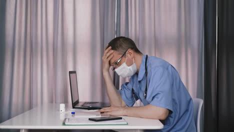 doctor writes with ballpoint pen fills medical card