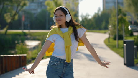 young woman enjoying a walk in a park