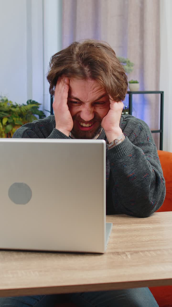 Tired caucasian man freelancer use laptop suffering from headache problem tension migraine stress