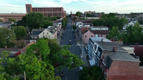 reverse dolly above city street in downtown area