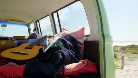 Guitar,-cloths-and-blanket-in-van-4k