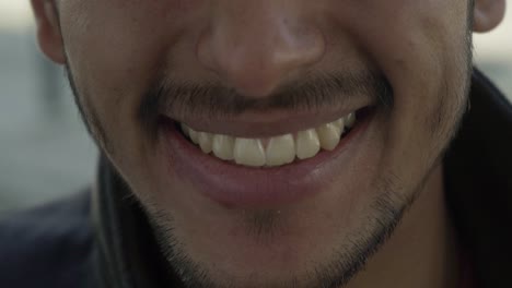 cropped shot of happy young man laughing