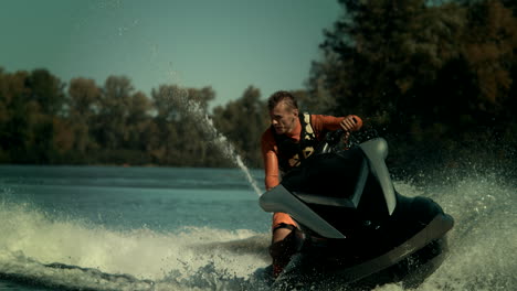 man rides jet ski on river