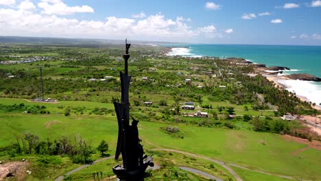 very tall statue of christopher columbus erected along the coast in arecibo, puerto rico