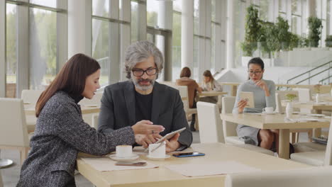 business people on coffee break at restaurant