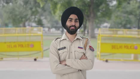 happy sikh indian police man standing