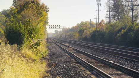 an expansive view of empty train tracks stretching into the distance, conveying a sense of solitude and adventure.