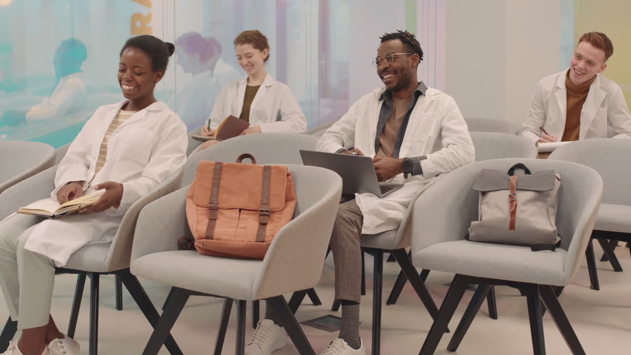 Cheerful Medical Students Applauding to Professor after Lecture