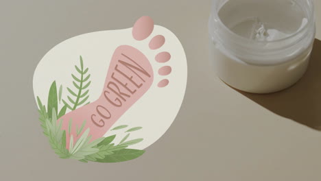animation of go green text, barefoot and plants logo, over face cream in jar on beige background