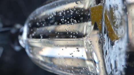 close-up of a glass of soda with lemon