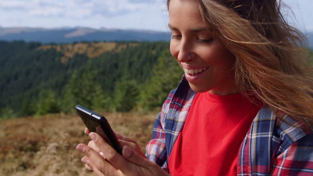 Woman zooming in on cellphone outdoor