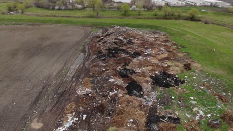 polluted hill near meadows by the river on remote area