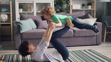 mother and child playing and exercising at home