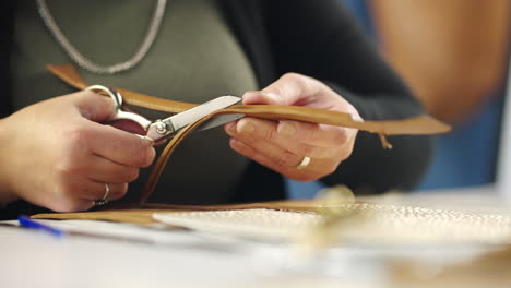 crafting leather with scissors