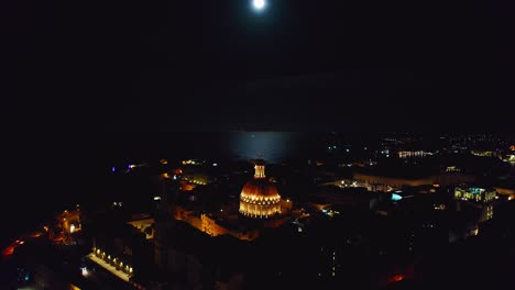 full moon over valletta, capital of malta, with basilica of our lady of mount carmel cathedral