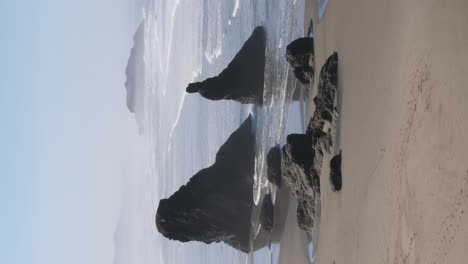 Vertical-shot-of-the-rock-columns-on-Bandon-Beach-in-Oregon