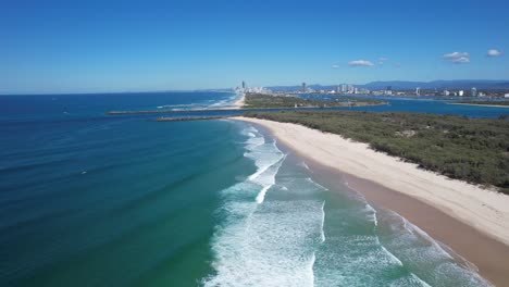 perfect waves - the spit - south stradbroke island and southport - gold coast - qld - queensland - australia - pull back and up aerial shot