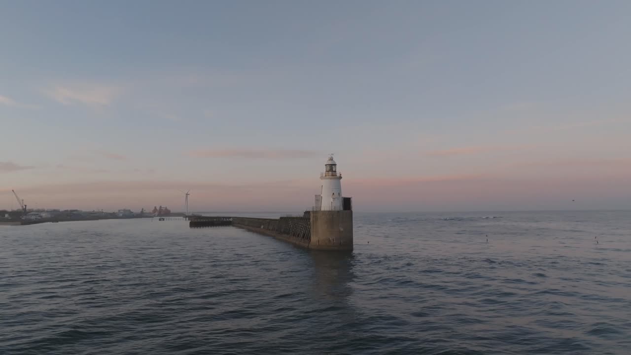 Captivating drone footage of the lighthouse as it basks in the twilight