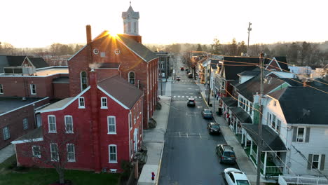 aerial establishing shot of small town usa at sunrise