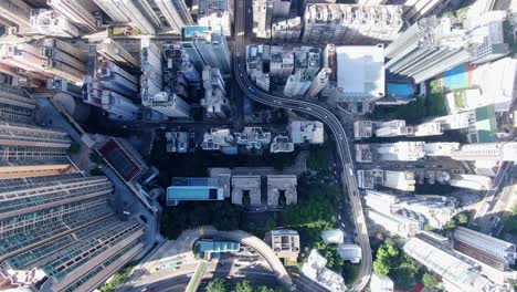 Downtown-Hong-Kong-city-skyscrapers-and-urban-traffic,-Aerial-view