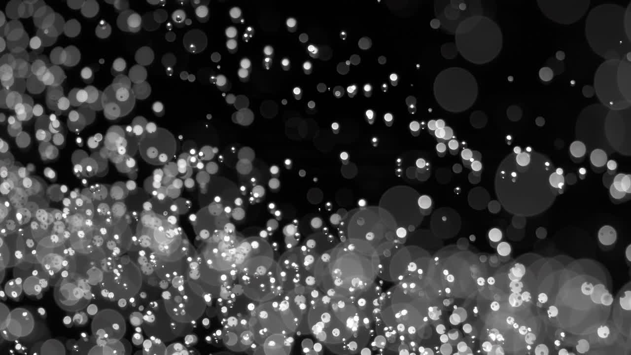 плавающая абстрактная частица боке на темном фоне, снятая с помощью супермедленной камеры
