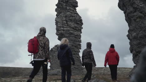 hikers near rock formations