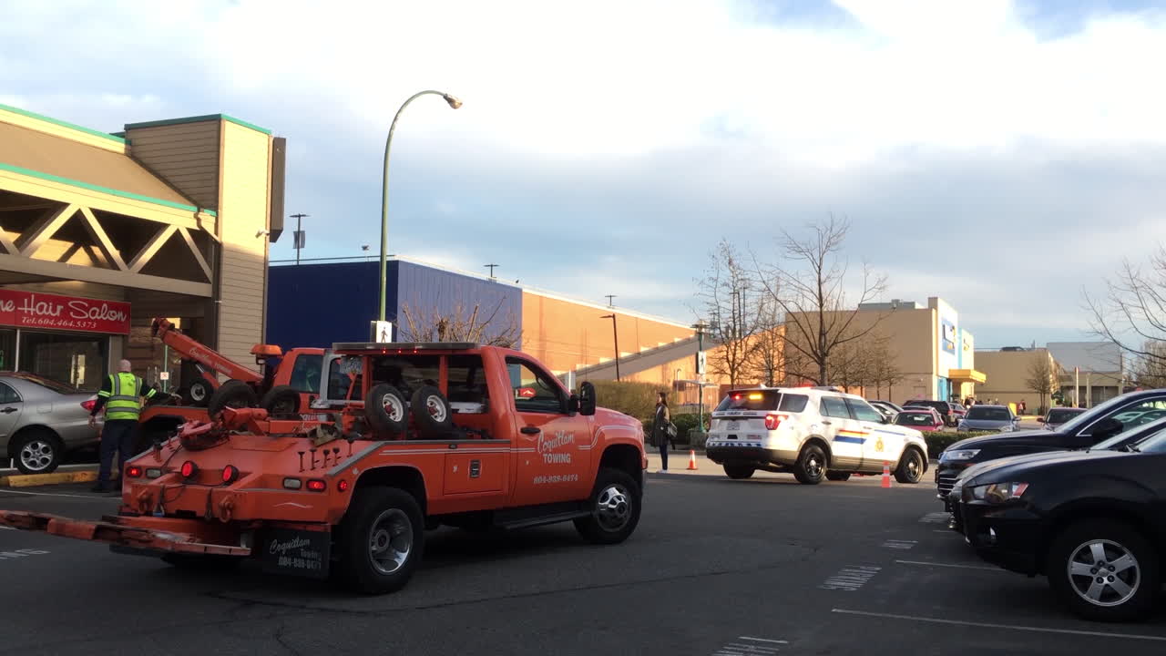 Motion of red and blue emergency lights of police cars and tow car on road for car accident scene with 4k resolution