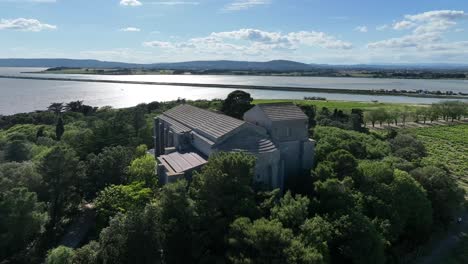 the maguelone cathedral from the12th-century roman architecture near the mediterranean coast of france with renovated roof, aerial pedestal up shot