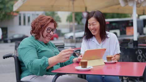 two women at an outdoor cafe