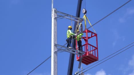 power line workers in aerial lift